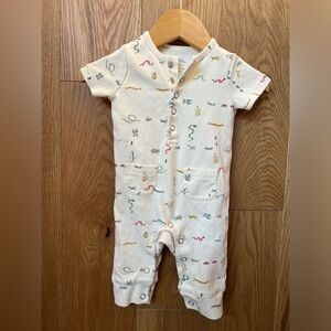 Charming Cream Bodysuit with Colorful Accents